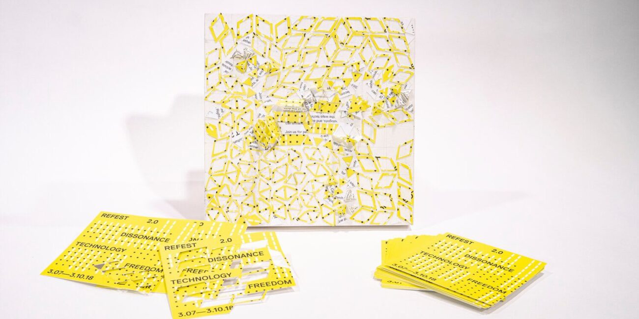 A set of yellow and white cards on a white surface.