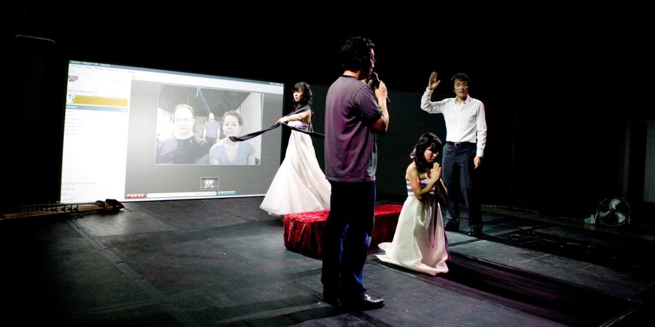 A group of people standing on a stage.