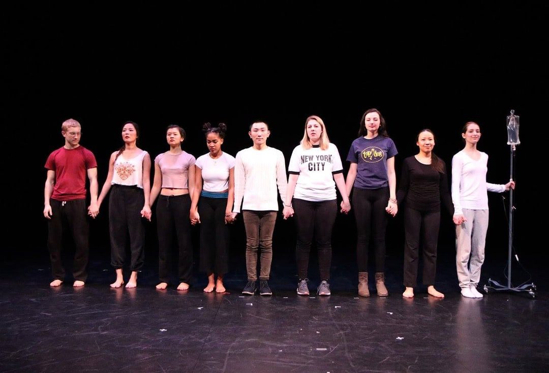 A group of people standing on a stage.